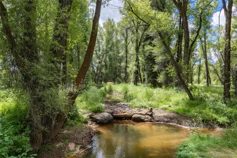 a view of lake with green space