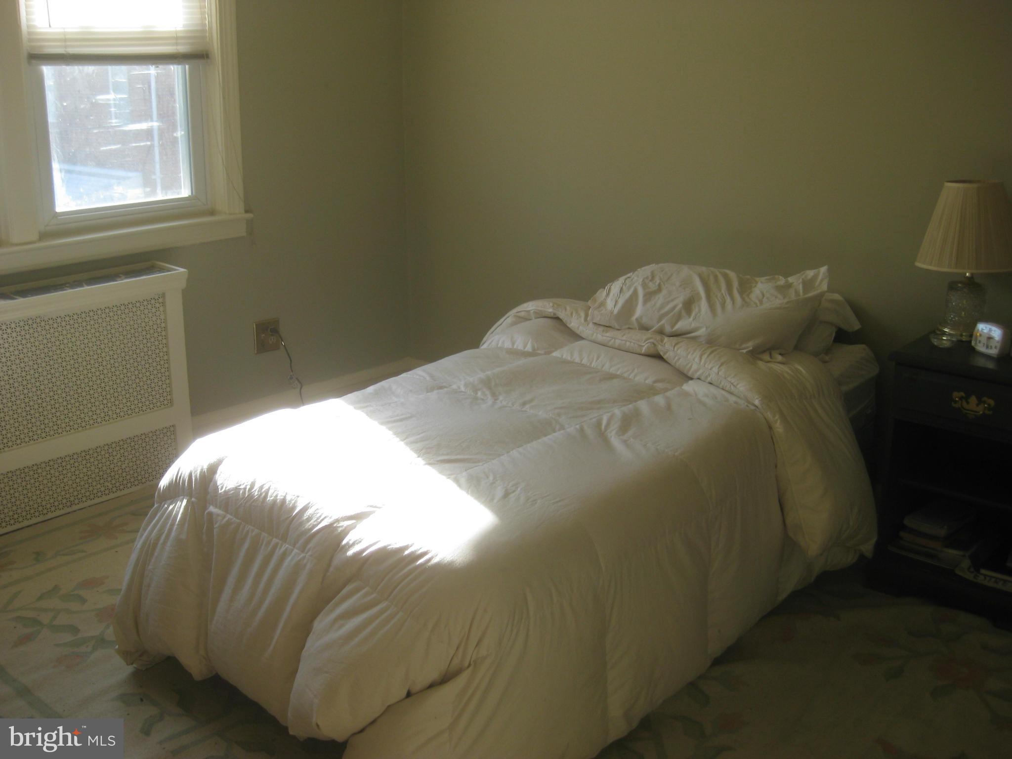 1117 Cedarcroft Road Baltimore, MD 21239 - Photo 5 of 11 a close up of a bed in a small room