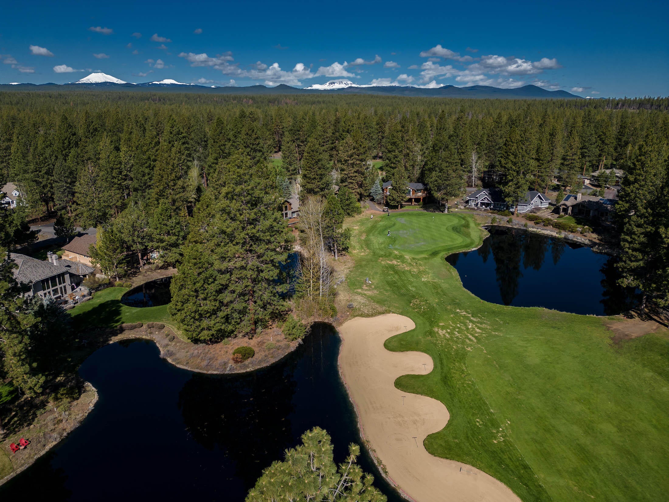 60711 Golf Village Loop Bend, OR 97702 - Photo 27 of 31 Drone photo above the lot shooting west toward Mt. Bachelor and the Cascade Mountains behind the 6th green