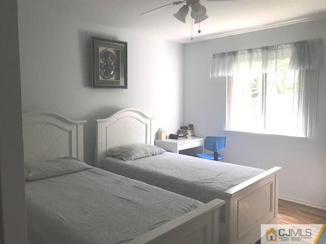 1 Sunflower Court Edison, NJ 08820 - Photo 11 of 15 a bedroom with a bed and a window