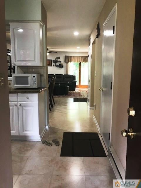 1 Sunflower Court Edison, NJ 08820 - Photo 4 of 15 a large bathroom with a large mirror vanity and toilet