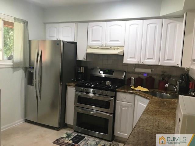 1 Sunflower Court Edison, NJ 08820 - Photo 5 of 15 a kitchen with granite countertop a refrigerator stove and sink