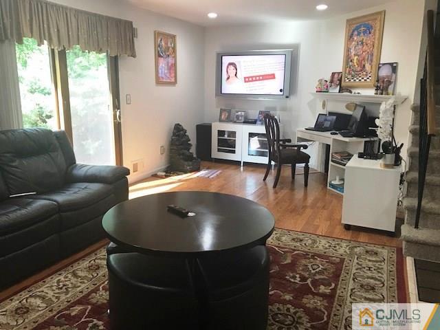 1 Sunflower Court Edison, NJ 08820 - Photo 8 of 15 a living room with furniture and a flat screen tv