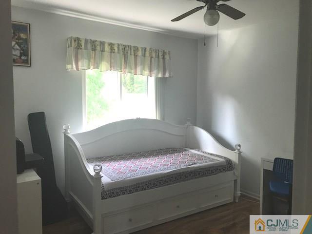 1 Sunflower Court Edison, NJ 08820 - Photo 10 of 15 a bed sitting in a room next to a window
