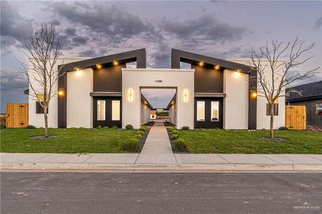 a view of house with a yard