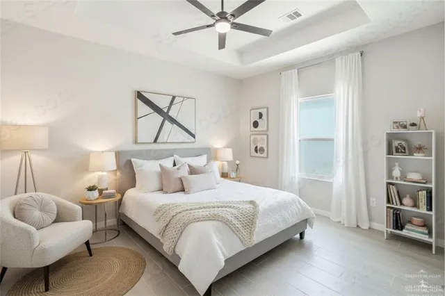 a bedroom with a bed and a couch