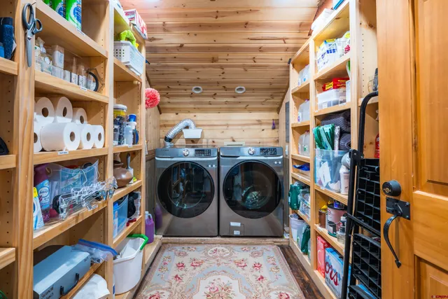 a bedroom with two beds and a window