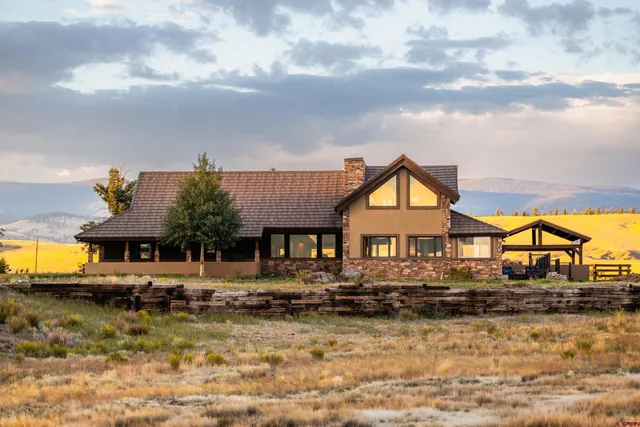 a view of a house with a big yard