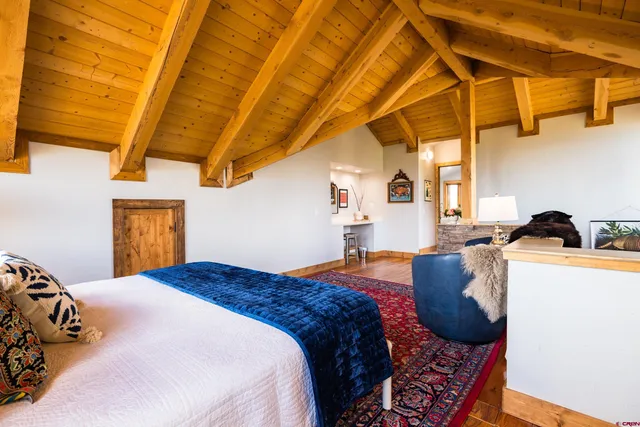 a bathroom with a bathtub a sink and a large mirror