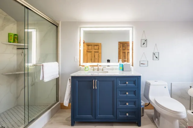 a bed room with furniture and a large window