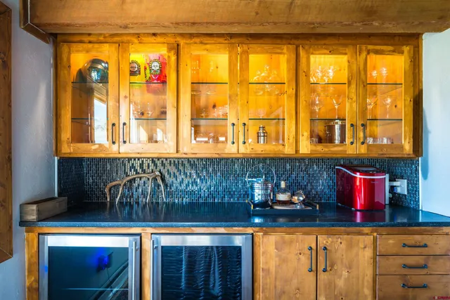 a bed room with a bed and dresser with mirror