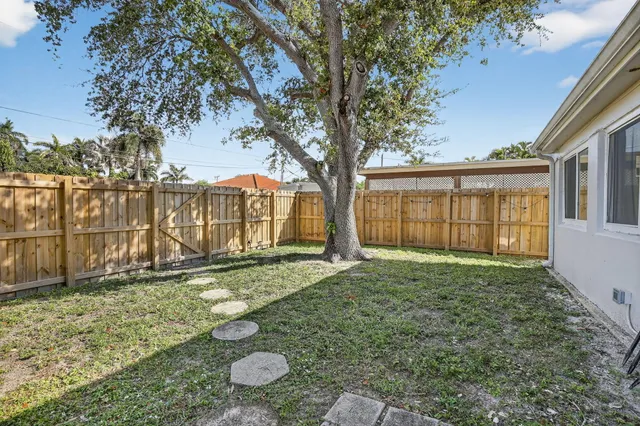 a backyard of a house with lots of green space