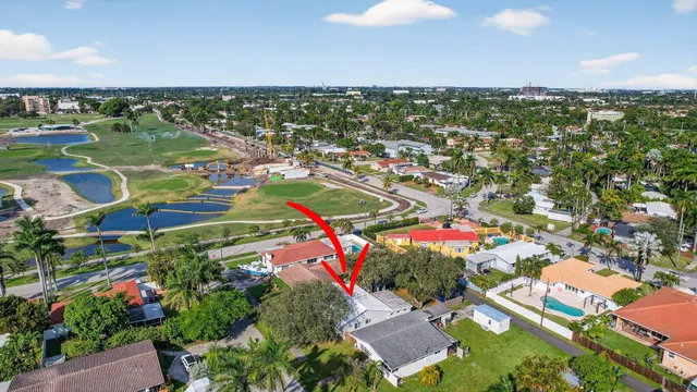 an aerial view of a residential houses with outdoor space