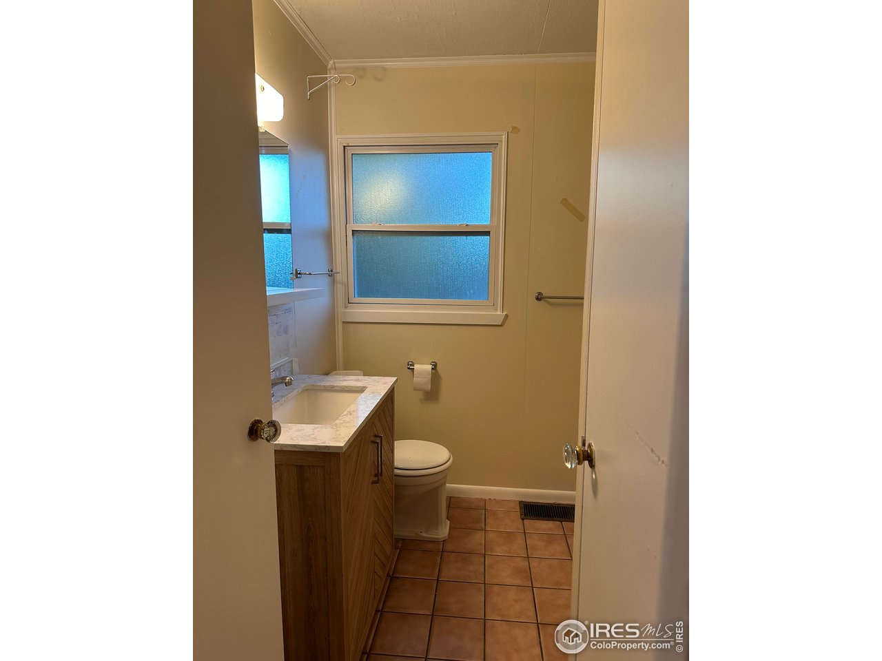 2324 19th Street Boulder, CO 80304 - Photo 11 of 33 a bathroom with a sink a toilet and mirror