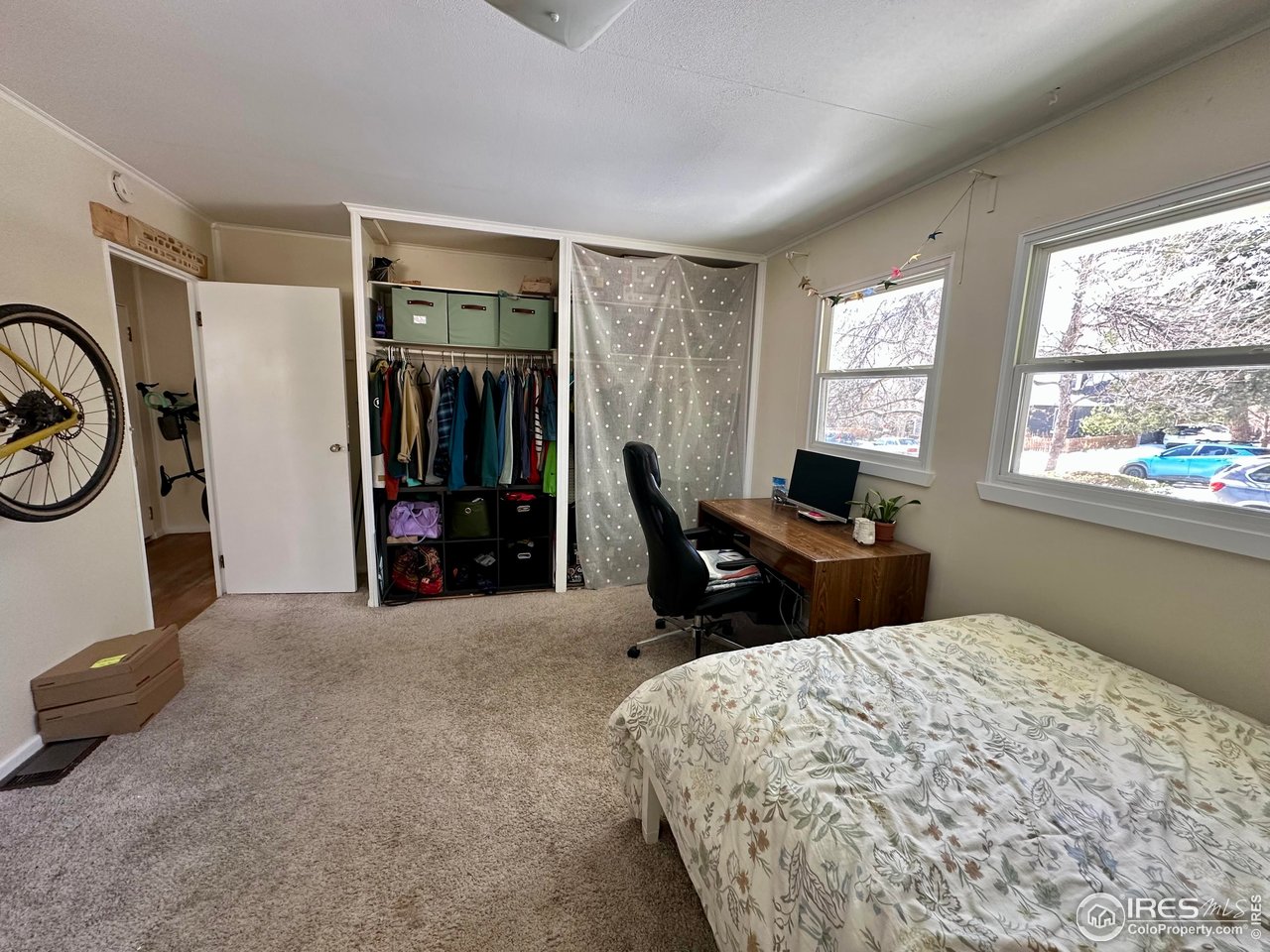 2324 19th Street Boulder, CO 80304 - Photo 15 of 33 a bed room with a bed and a chair