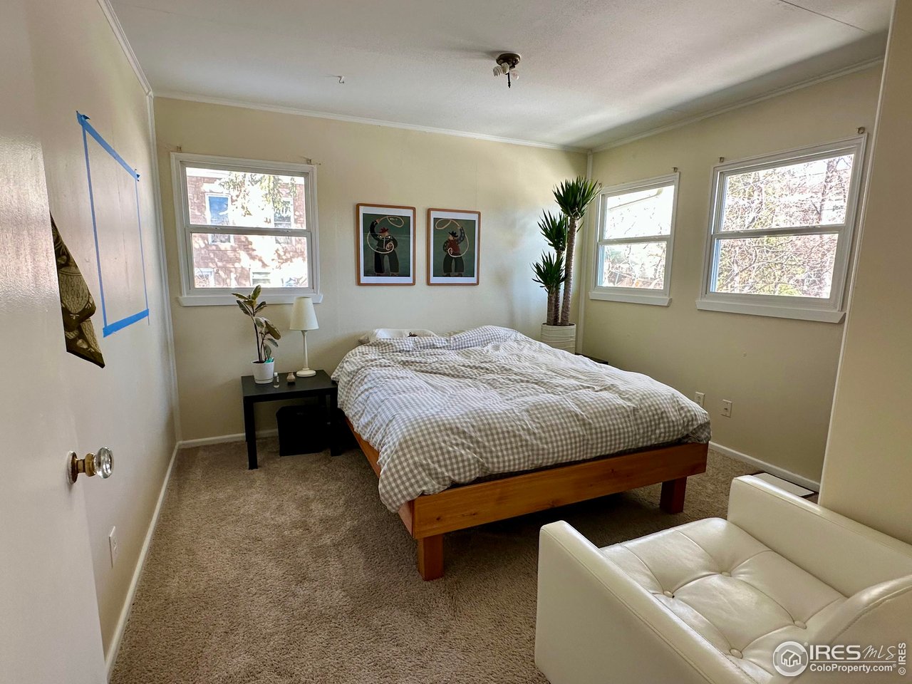 2324 19th Street Boulder, CO 80304 - Photo 17 of 33 a bedroom with a bed and wooden floor