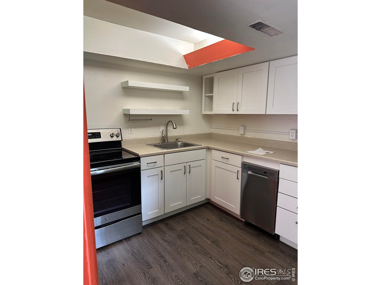 2324 19th Street Boulder, CO 80304 - Photo 22 of 33 a kitchen with a sink cabinets stainless steel appliances and a window