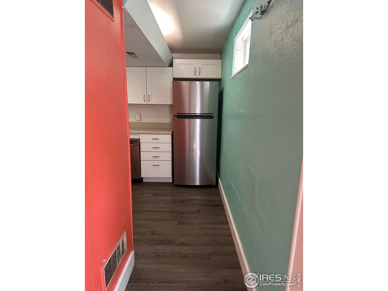 2324 19th Street Boulder, CO 80304 - Photo 23 of 33 a view of a refrigerator in kitchen and an empty room