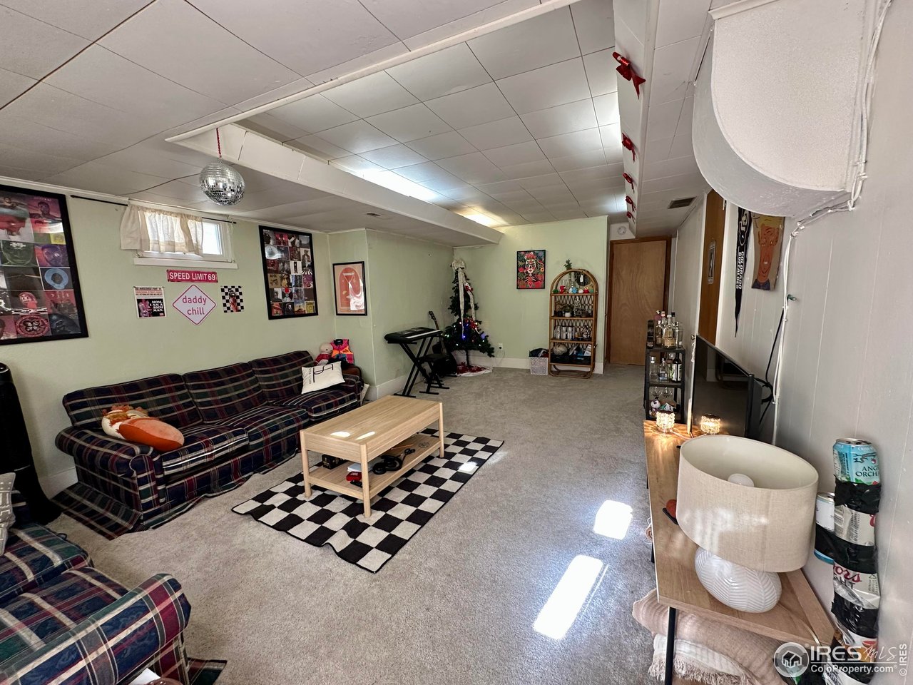 2324 19th Street Boulder, CO 80304 - Photo 24 of 33 a room with furniture a rug and a chandelier