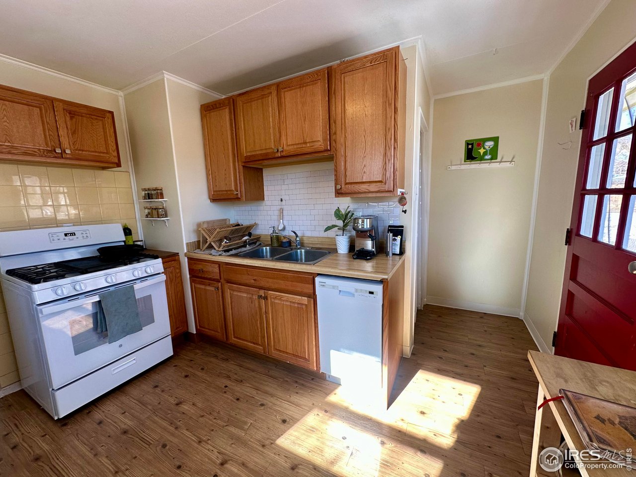 2324 19th Street Boulder, CO 80304 - Photo 7 of 33 a kitchen with stainless steel appliances granite countertop a stove a sink and a refrigerator