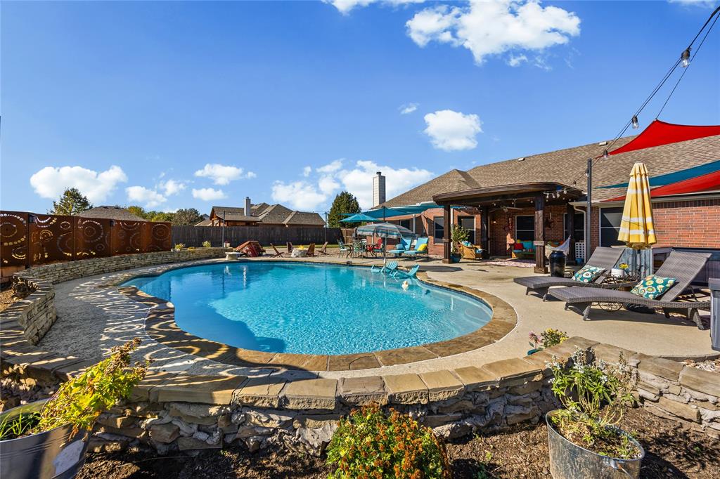 112 Springfield Lane Red Oak, TX 75165 - Photo 30 of 40 a swimming pool view with a seating space