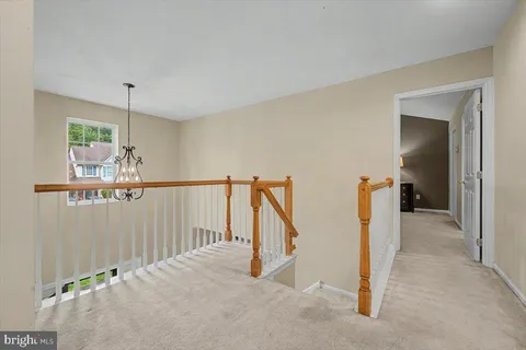 a view of a hallway with windows
