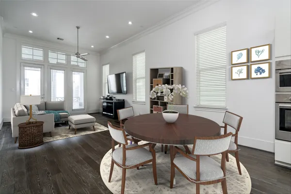 a view of a dining room with furniture and wooden floor