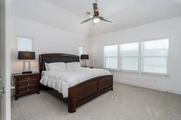 a bedroom with a bed and window