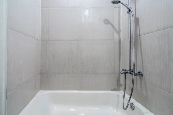 a close view of a bathtub in bathroom