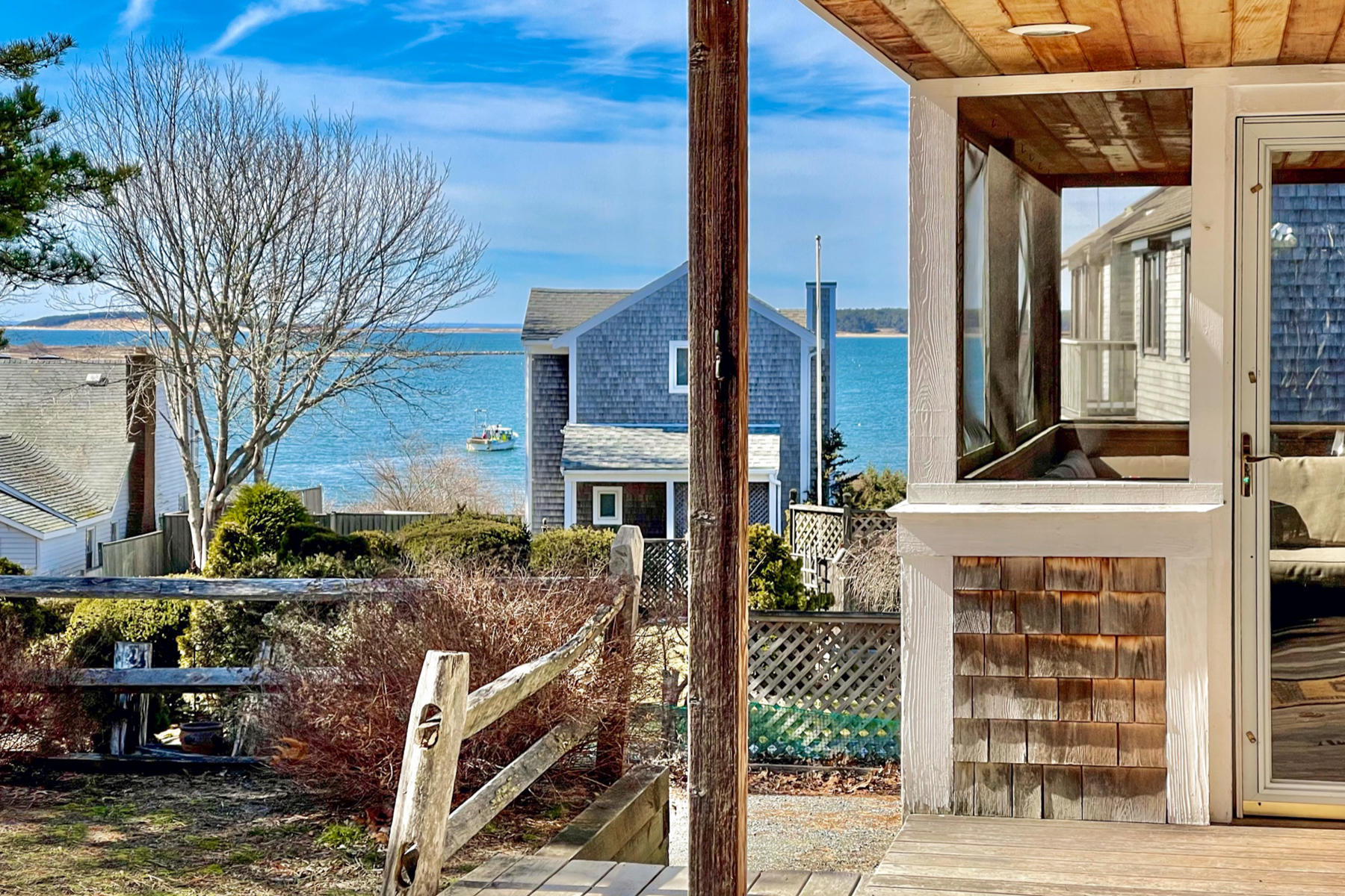 155 Nauhaught Bluff Road Wellfleet, MA 02667 - Photo 11 of 53 a front view of a building with street