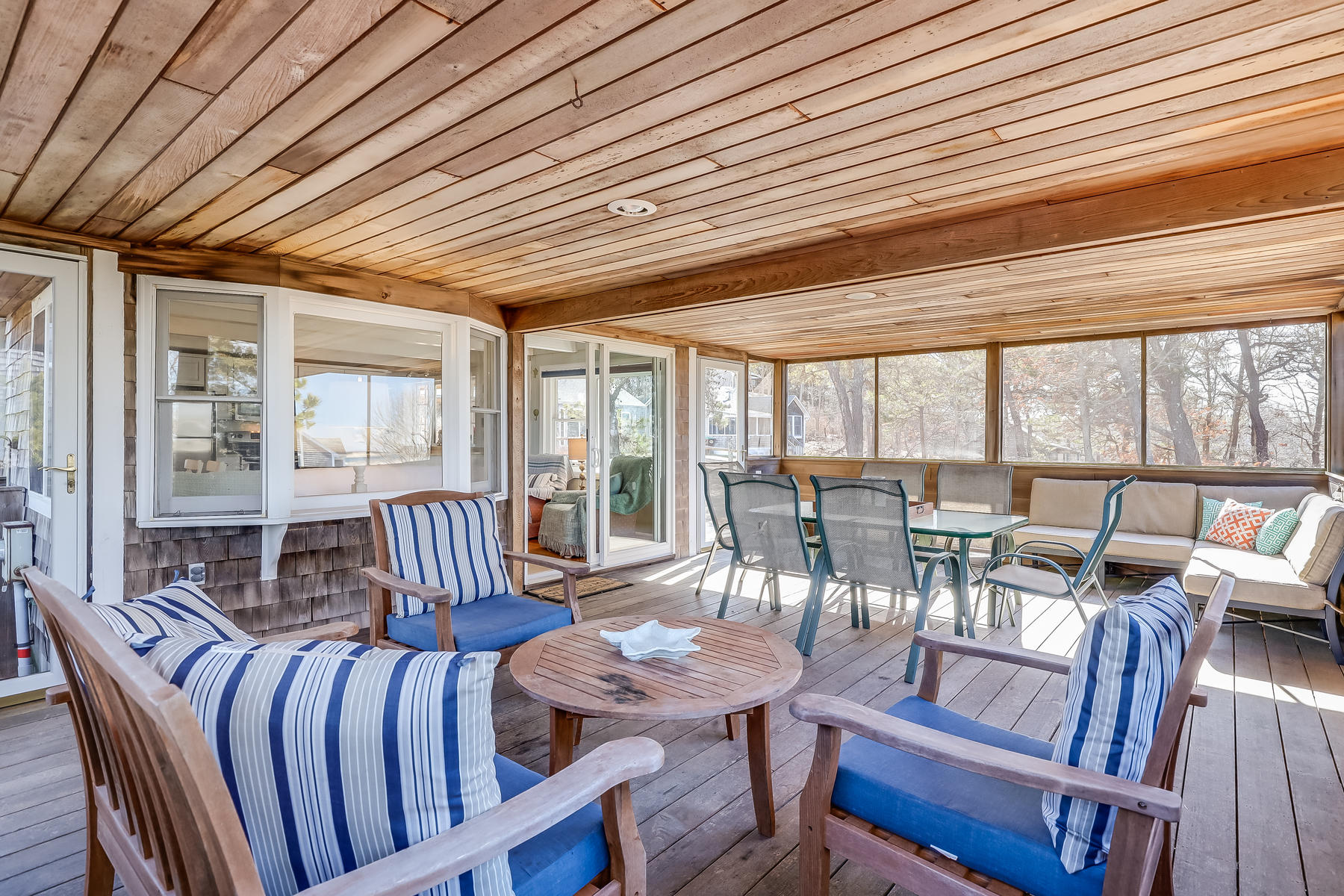 155 Nauhaught Bluff Road Wellfleet, MA 02667 - Photo 17 of 53 a view of a dining room with furniture window and outside view