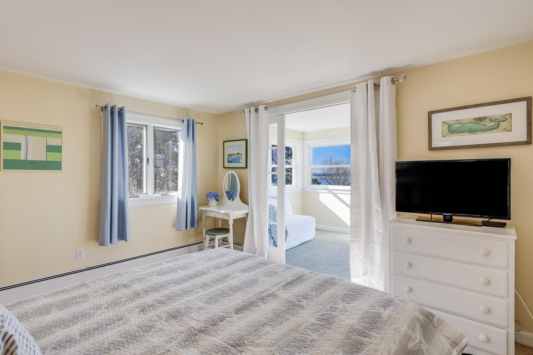155 Nauhaught Bluff Road Wellfleet, MA 02667 - Photo 21 of 53 a view of a livingroom with wooden floor and a flat screen tv