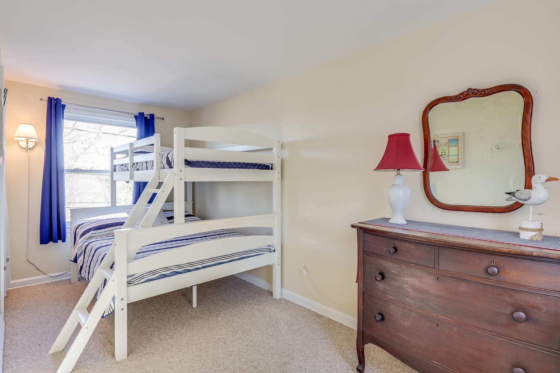 155 Nauhaught Bluff Road Wellfleet, MA 02667 - Photo 29 of 53 a bedroom with a bed and a dresser