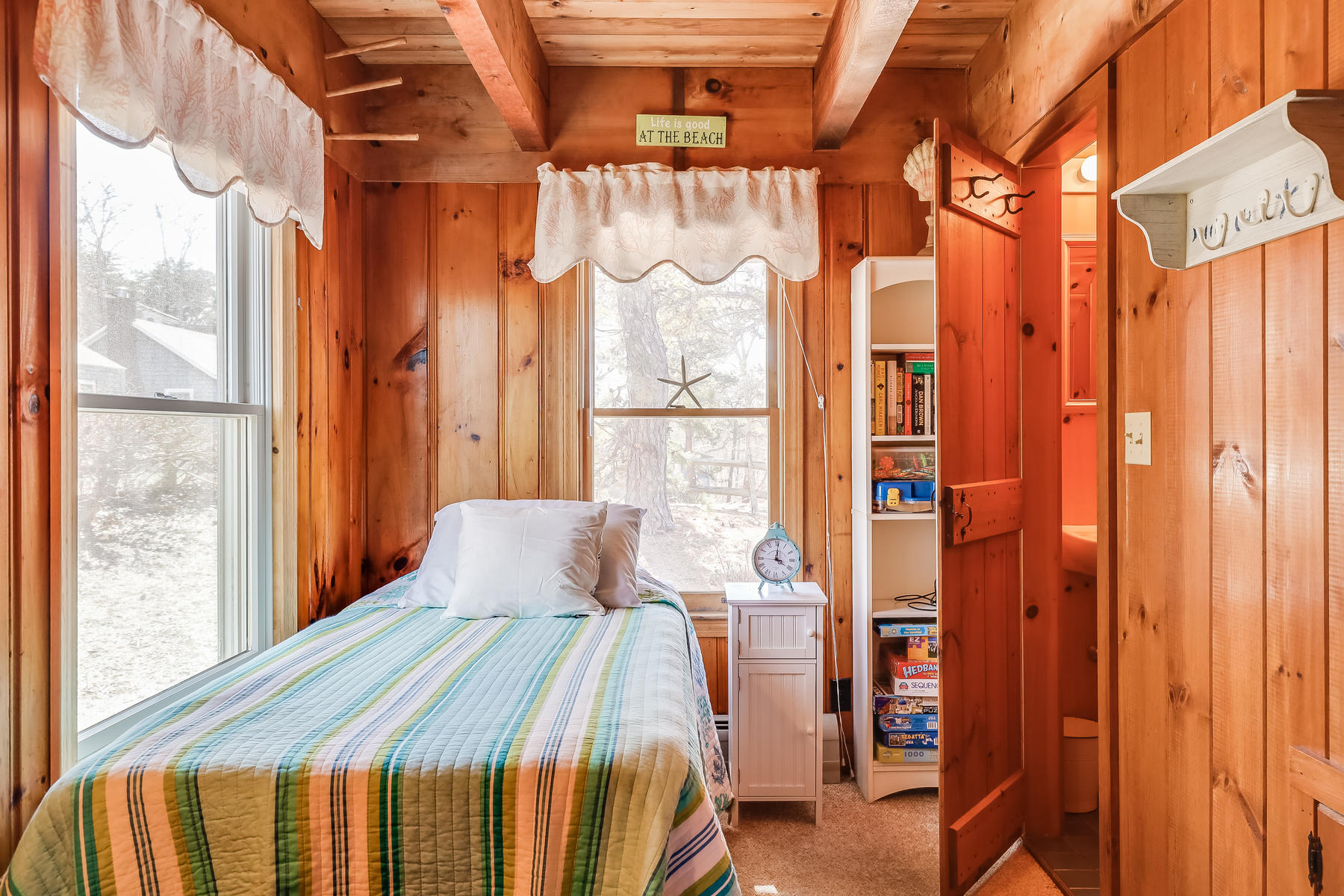 155 Nauhaught Bluff Road Wellfleet, MA 02667 - Photo 30 of 53 a bedroom with a bed and a window