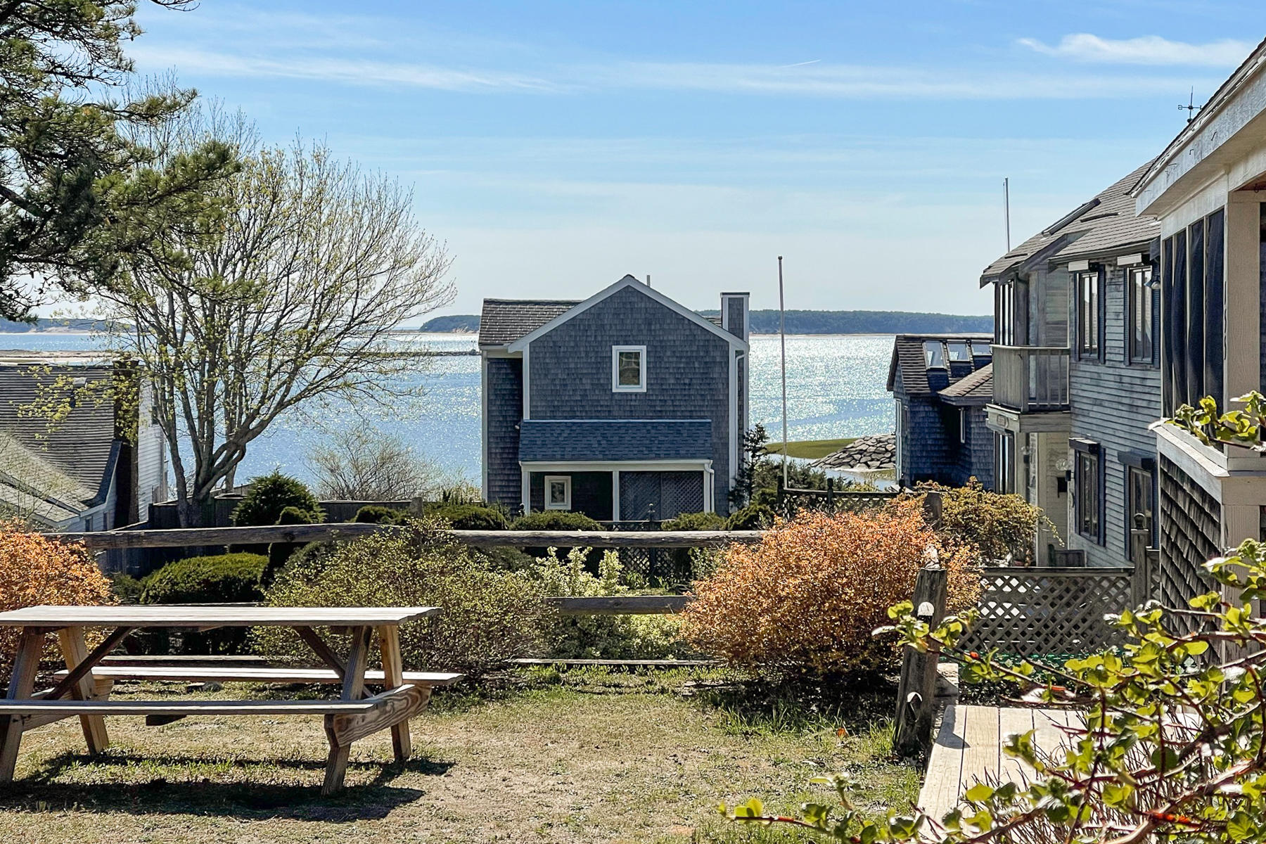 155 Nauhaught Bluff Road Wellfleet, MA 02667 - Photo 43 of 53 a front view of a house with a yard