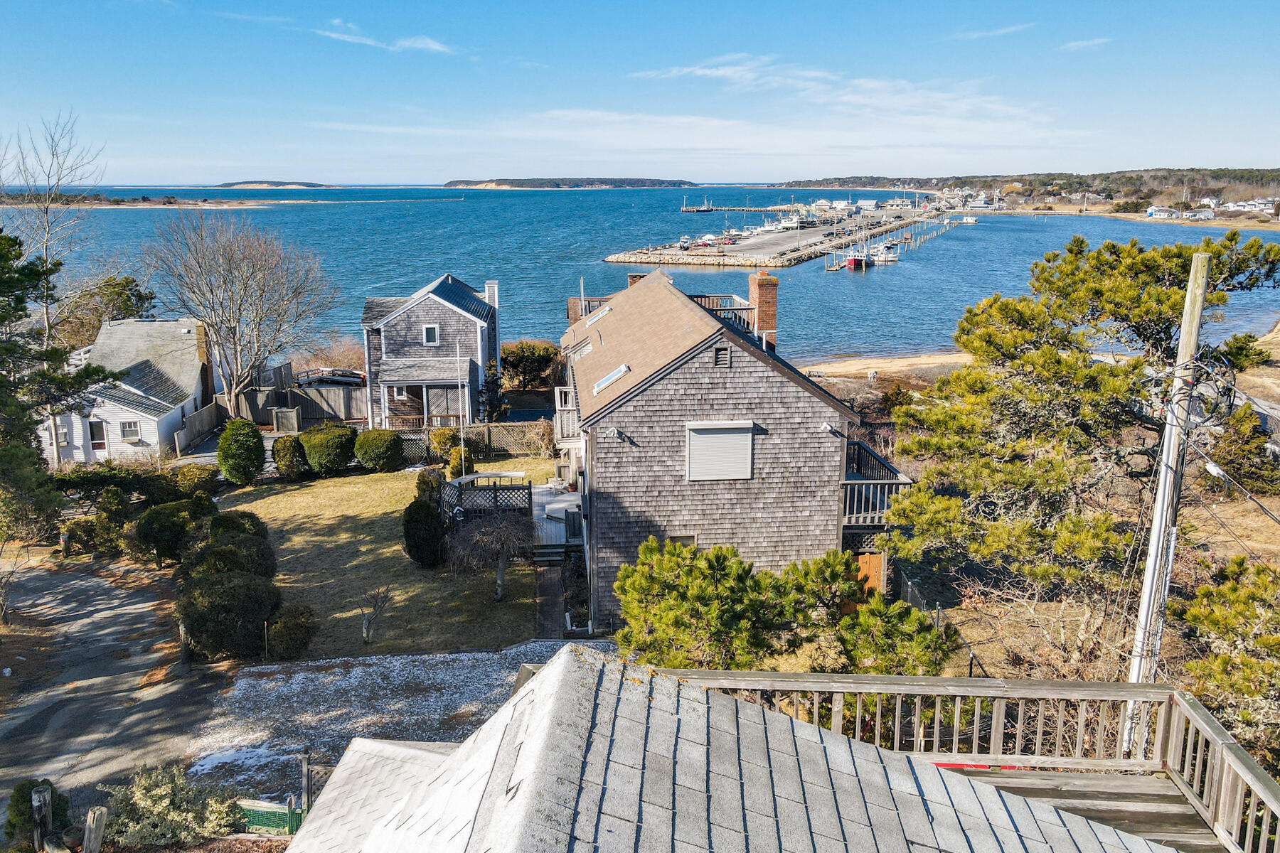 155 Nauhaught Bluff Road Wellfleet, MA 02667 - Photo 5 of 53 an aerial view of a house with a garden