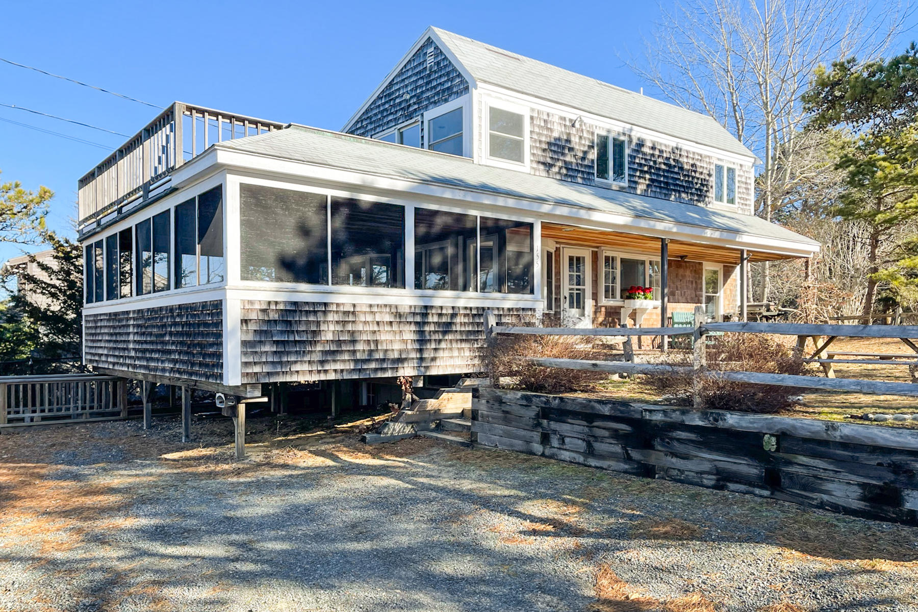 155 Nauhaught Bluff Road Wellfleet, MA 02667 - Photo 52 of 53 a front view of a house with swimming pool