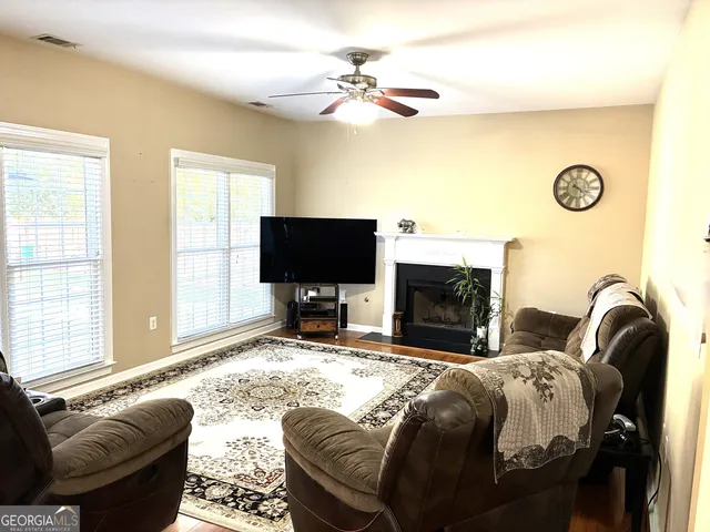 a spacious bedroom with a bed and a fireplace