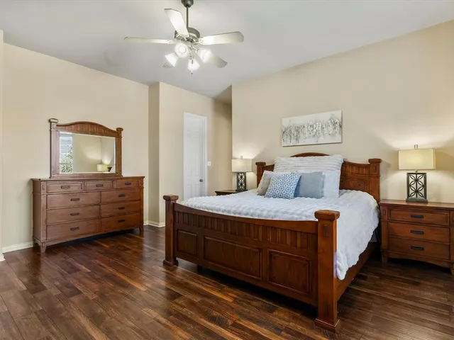 a bedroom with a bed and a dresser