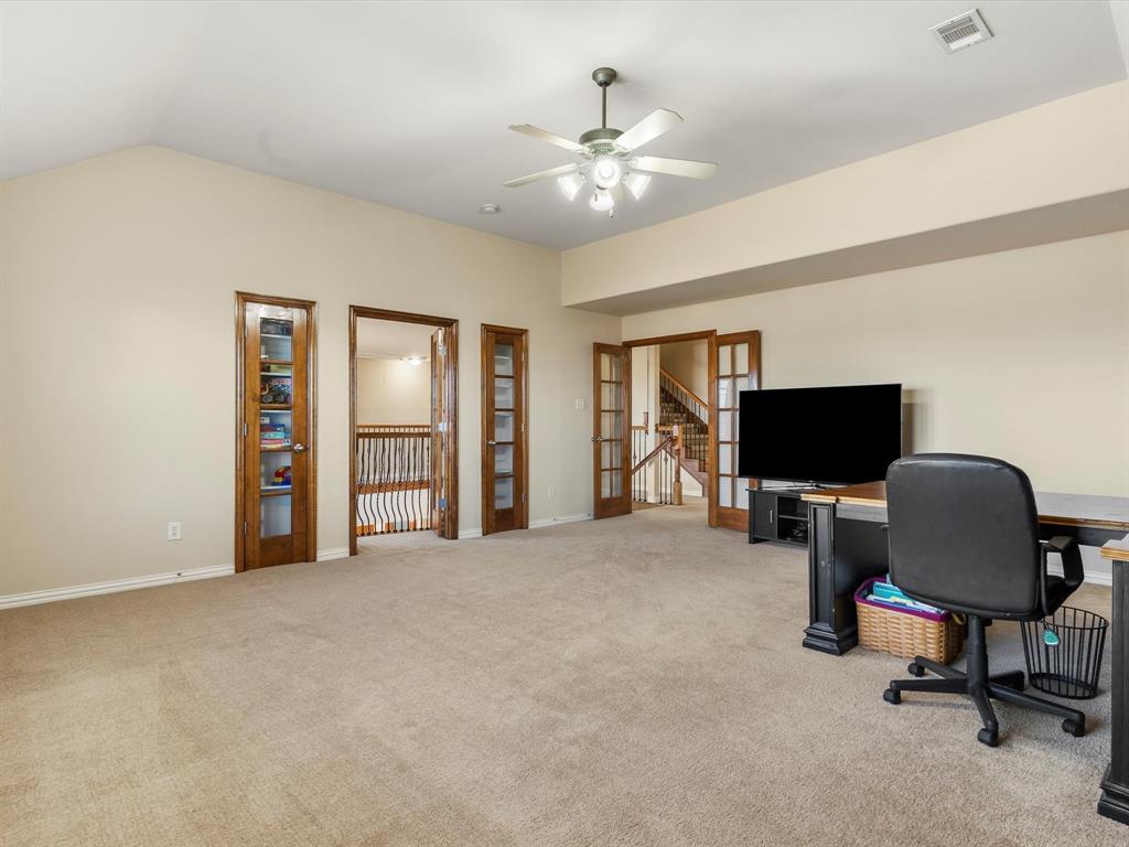 5365 Royal Lytham Road Fort Worth, TX 76244 - Photo 21 of 37 a view of a livingroom with workspace and a window