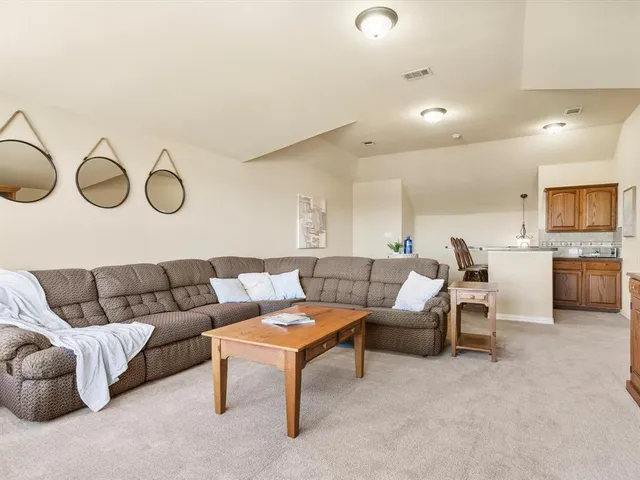 a building outdoor space with patio furniture and a potted plant