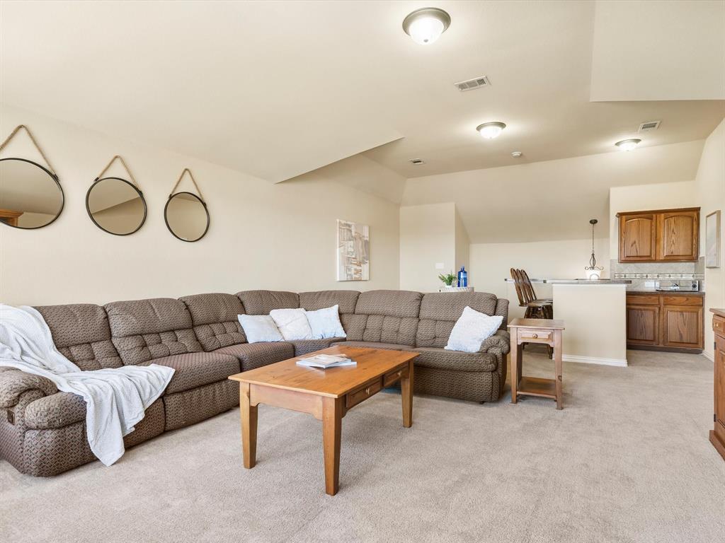 5365 Royal Lytham Road Fort Worth, TX 76244 - Photo 30 of 37 a living room with furniture and a view of kitchen