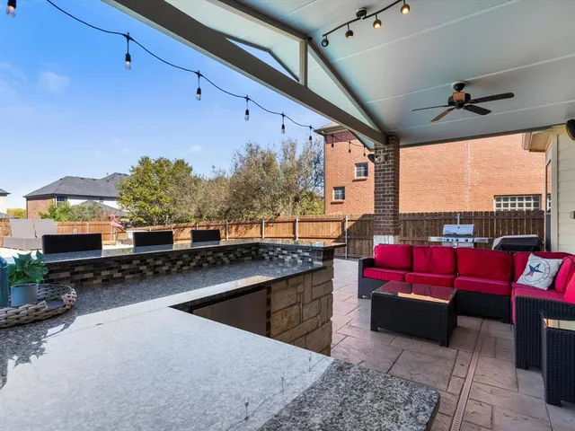 a view of a swimming pool and lounge chairs
