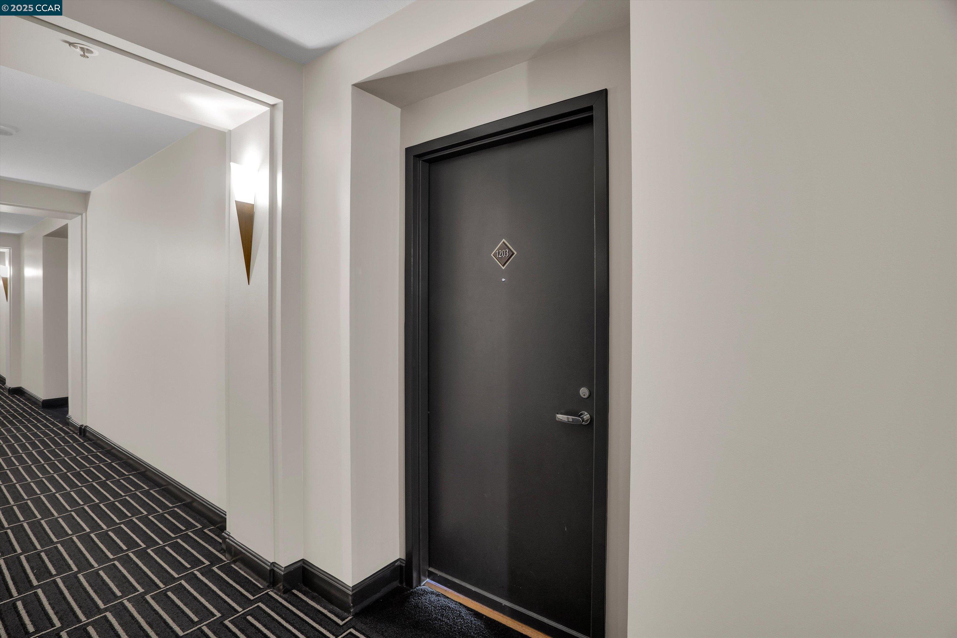 300 3rd Street, Unit 1203 San Francisco, CA 94107 - Photo 16 of 25 a view of a hallway with wooden floor