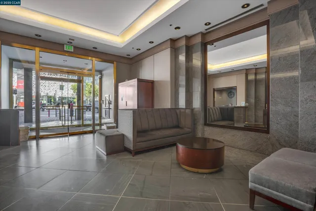 a lobby with furniture and a potted plant