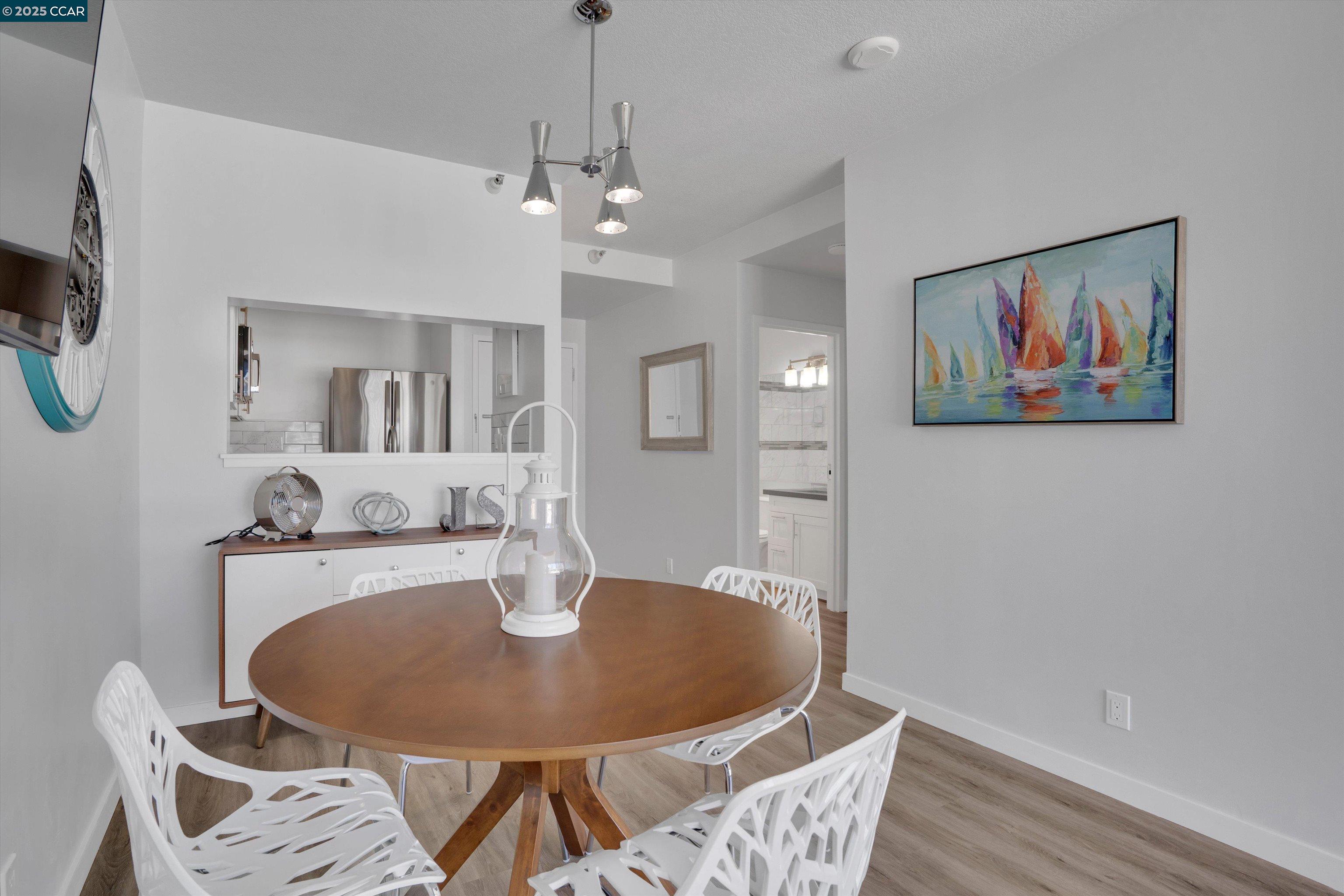 300 3rd Street, Unit 1203 San Francisco, CA 94107 - Photo 8 of 25 a dining room with furniture and window