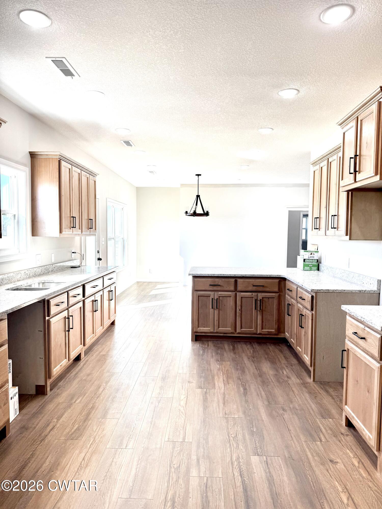 a bathroom with a double vanity sink a mirror and a bathtub