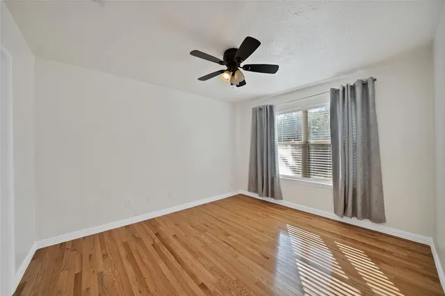 a bathroom with a sink toilet vanity and shower