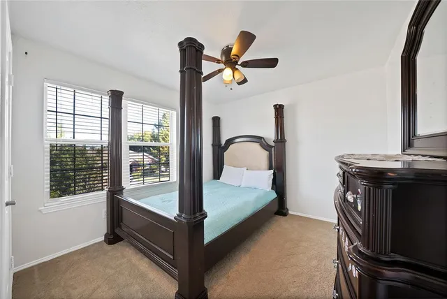 a bathroom with a bathtub sink and mirror