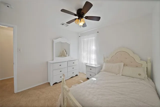 a spacious bathroom with a double vanity sink a mirror a window and a bathtub